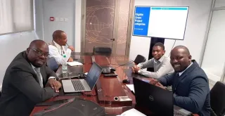 Joshua Mabeta (right/in grey sweater), national UN Volunteer Research Assistant with the UNDP BIOFIN Zambia Team, providing capacity building in green finance to Pangaea Securities.