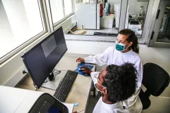 International UN Volunteer Ines Rodrigues (with the green mask) analyzing COVID-19 samples in Sao Tome and Principe national laboratory.
