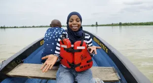 UN Volunteer Rafiat Atanda films a documentary showing UNODC’s work in communities across Bayelsa State, Nigeria.
