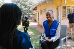Rutendo Bamhare, UN Volunteer Communications Specialist with UNICEF interviews community members as part of her volunteer assignment.
