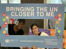 Moeka Sakamoto (left), UN Youth University Volunteer Communications Assistant with UNIC, and her supervisor, Mark Maseko, at a UN Job Fair in East Park Mall in Lusaka, Zambia.