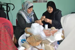 Shahd El-Swerki (left), national UN Volunteer Communications Assistant at UNDP Gaza, visited a cancer care centre and joined women volunteers in sewing breast prosthetics, which are distributed for free to female cancer patients.