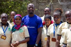 UN Volunteer Blasio Amoche Omulama, Monitoring and Evaluation Specialist (WFP) with the ‘Rescue Divas Women’s VSLA Group’ in Isiolo County, Kenya.