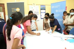 UN Community Volunteer Peer Educators conduct community mapping with the beneficiaries of the Nagaswatte community in Sri Lanka.