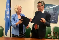 Under-Secretary-General for Management Ms Jan Beagle and UNV Executive Coordinator Olivier Adam sign the Memorandum of Understanding in New York.