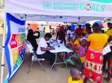UNDP Zimbabwe staff and volunteers interact with community members during field visit to Mbire district in northern Zimbabwe.