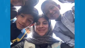 Golazin Hemmaty, UN Volunteer with UNICEF interacts with children in Tehran.