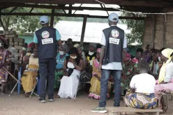 UN Community Volunteers in Foya Lofa Country meet with people with disabilities to discuss COVID-19 preventive measures.