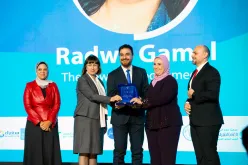 H.E. Nivine El-Kabbag, Egypt's Minister of Social Solidarity (right) and Elena Panova, UN Resident Coordinator in Egypt (left) hand out a trophy to Salem Hussein, one of UNV50 Egypt Award winners.