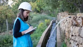 Raymonda Chamoun, national UN Volunteer Specialist Water/Irrigation Engineer with UNDP Lebanon monitors the implementation of irrigation canal rehabilitation project in Sir El-Denniyeh, north Lebanon.