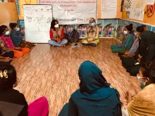 Urmi Tanchangya (third from left) is a national UN Volunteer Programme Assistant with UNFPA in Bangladesh. Here, she discusses with adolescents and youth during a session on the life skills education approach dubbed Girl Shine Programme.