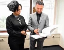 Shirin Abidova, Adviser to the Director of the Youth Affairs Agency of Uzbekistan, was presented the 2026 State of the World's Volunteerism Report by Toily Kurbanov, UNV Executive Coordinator at the UN Campus in Bonn.