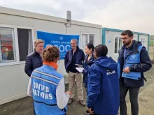 Fatma Aslan Uçar (left) and Velat Özalp (far right) are committed national UN Volunteers who have played critical roles in OCHA's earthquake response and recovery efforts.