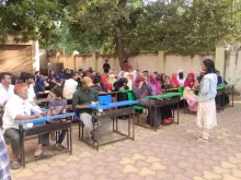 Poonam Kashyap (standing, right) UN Volunteer Social and Behaviour Change Communications Officer with UNICEF India at a community outreach to raise awareness of child marriage in Maharashtra.