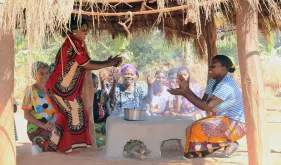 Women in Matebo Village in Kalumbila District, Zambia, try out their new energy-saving stoves .