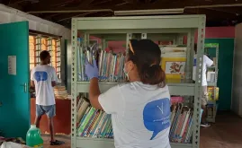 UN Volunteers cleaning St Christopher’s home library, where they conducted a book drive for disadvantaged children.