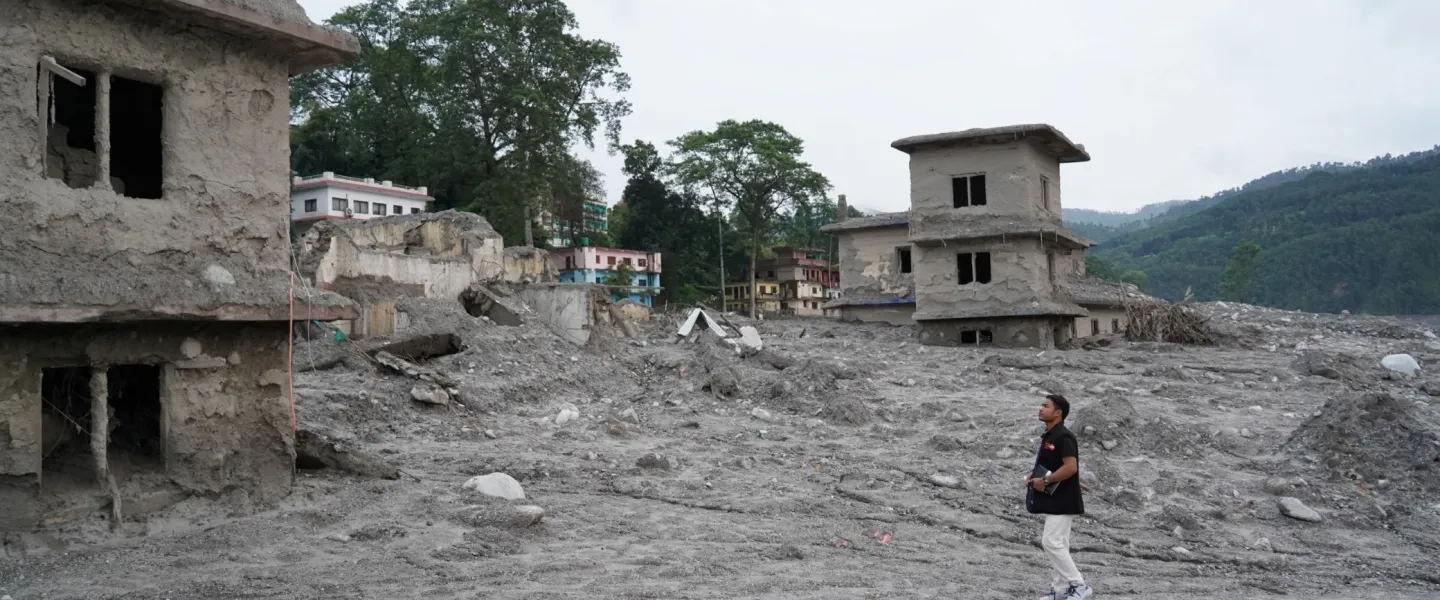 A UN Volunteer with the United Nations Population Fund, Ashok Chaudhary, assesses flood-affected Nuwakot and Rasuwa Districts for emergency supply distribution in early September 2026.