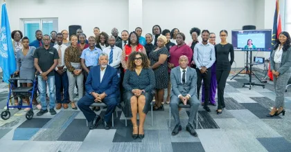UN Volunteer with UNESCO, Arita Arania Phillip (right), at a workshop in Antigua and Barbuda, which engaged over 500 Caribbean youth on digital literacy, misinformation, mental health and cybercrime.