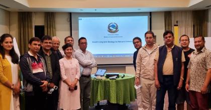 Rassu Manandhar (centre), national UN Volunteer Specialist with UNDP, during the finalization of the Long-Term Strategy for Net Zero Emission of Nepal, with counterparts and experts from the Ministry of Forests and Environment, UNDP, and the Commonwealth and Development Office.