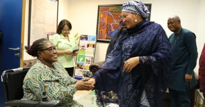Ekaete Judith Umoh, UN Volunteer, greets UN Deputy Secretary-General, Amina Mohammed, at the UN House in Nigeria. 