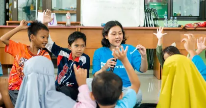 Volunteers support well-being in communities. Photo from Indonesia referenced in the 2026 SWVR.