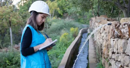 Raymonda Chamoun, national UN Volunteer Specialist Water/Irrigation Engineer with UNDP Lebanon monitors the implementation of irrigation canal rehabilitation project in Sir El-Denniyeh, north Lebanon.