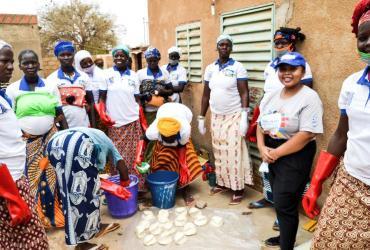 International UN Volunteer Deborah Benja, visiting women soap producers from Barsalogho, Burkina Faso.