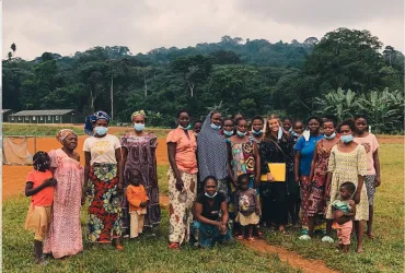 UN Youth Volunteer Fannie Elvejung (holding a yellow folder) meets communities to assess their needs with UNDP Cameroon.