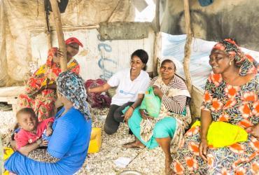 UN Community Volunteer Fatoumata Gaam visiting the women entrepreneurs she assists in developing their fishery produces processing business in Bargny, Senegal.