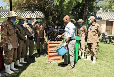 UN Volunteer Environmental Officer, Khalid Badr, demonstrates the compost activity in the UN compound in Kabul.