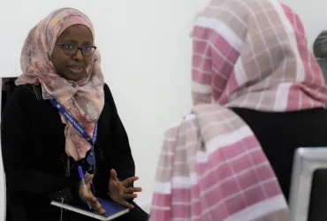 Anne Mungai (right), international UN Volunteer Staff Counselor with IOM, during a counseling session in Kabul, Afghanistan.