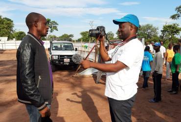 Omotola Akindipe, UN Volunteer Associate Reporting Officer for the UN Refugee Agency (UNHCR) in Angola, interviews refugees on various topics, including mental health and shelter requirements. 