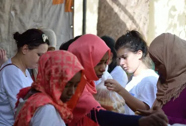 UNV participating in food distribution for Ramadan in cooperation with a local NGO, June 2016