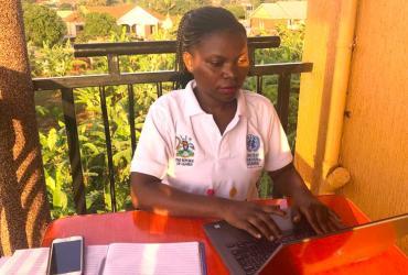Annet Nakaliti, national UN Volunteer with UNFPA in Uganda, working from home due to impact of COVID-19.