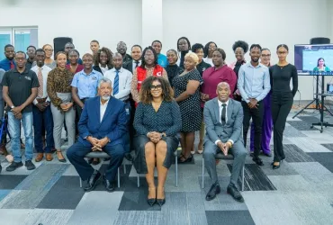 UN Volunteer with UNESCO, Arita Arania Phillip (right), at a workshop in Antigua and Barbuda, which engaged over 500 Caribbean youth on digital literacy, misinformation, mental health and cybercrime.