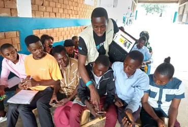 Volunteers raise awareness of education in the Democratic Republic of the Congo. Photo referenced in the 2026 SWVR.