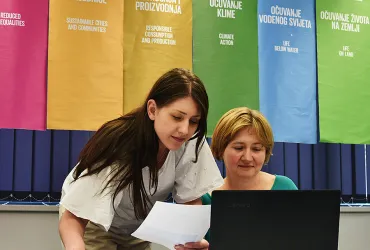 Matea Grabovac and Ehlimana Alibegovic-Goro (right) serve with UN Environment in Bosnia and Herzegovina; here they are at work at UN House in Sarajevo.