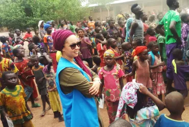 UN Volunteer Associate Field Protection Officer with UNHCR, Bouchra Makhlouf, with refugees from the Central African Republic in Goré refugee camp, Chad.