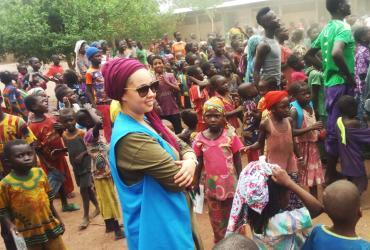 UN Volunteer Associate Field Protection Officer with UNHCR, Bouchra Makhlouf, with refugees from the Central African Republic in Goré refugee camp, Chad.