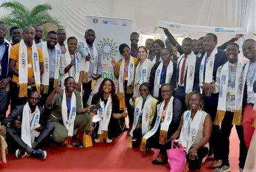 UN Volunteers at the fifteenth Conference of the Parties of the United Nations Convention to Combat Desertification (COP15) in Abidjan, Côte d'Ivoire.