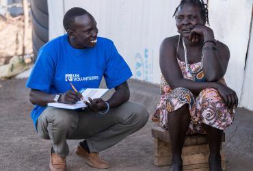One of the Refugee Volunteers, Ojala, conducting a community survey in the Kakuma refugee camp in Kenya. 