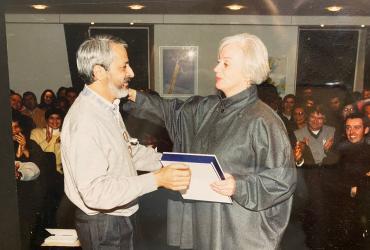 Douglas Evangelista receives a service award from the then Executive Coordinator of UNV, the late Sharon Capeling-Alakija.