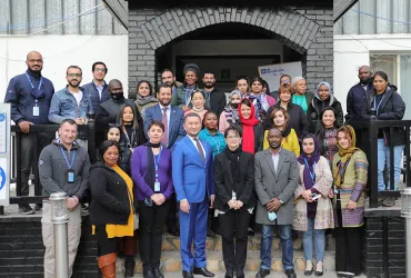 Toily Kurbanov, UNV Executive Coordinator, with UN Volunteers in Kabul, Afghanistan, on International Volunteer Day 2021.