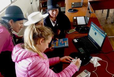 UN Volunteer Jasmin Blessing with indigenous women in Ecuador.
