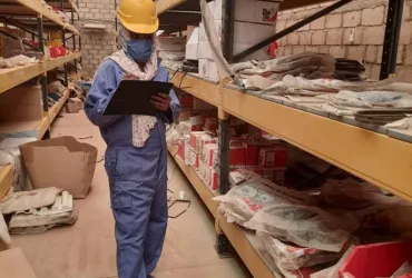 Ekram Fator, UN Volunteer Warehouse Assistant, checking fast moving spare parts in El-Fasher, Sudan.
