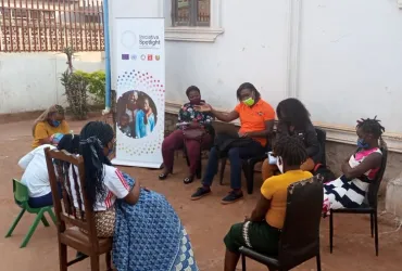 Farisai (in orange t-shirt) during a mentorship session on tackling Gender-Based Violence (GBV) in Mozambique