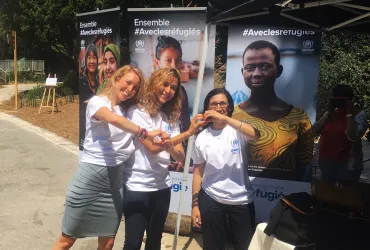 UN Volunteer Kamilia Lahrichi (centre) served as UN Volunteer Associate Public Information Officer with UNHCR in France.