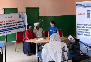 Japanese national, Emi Leung, UN Volunteer Governance Officer with UNDP in The Gambia, engages with communities on the Joint United Nations Programme on HIV/AIDS.