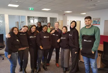 Hina Javed (third from left), international UN Volunteer, Associate Human Resource Officer with WHO Hungary poses for a photo with her colleagues.