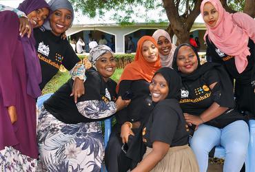 Aisha Hussein (centre, with orange scarf) and her team from Every Girl’s Dream pose for a picture during the anti-FGM youth caravan in Isiolo county, Kenya.